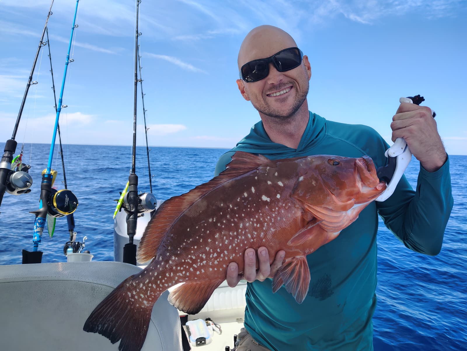 Capt Eric's Fire Truck, another massive Red Grouper caught jigging 30mi offshore.